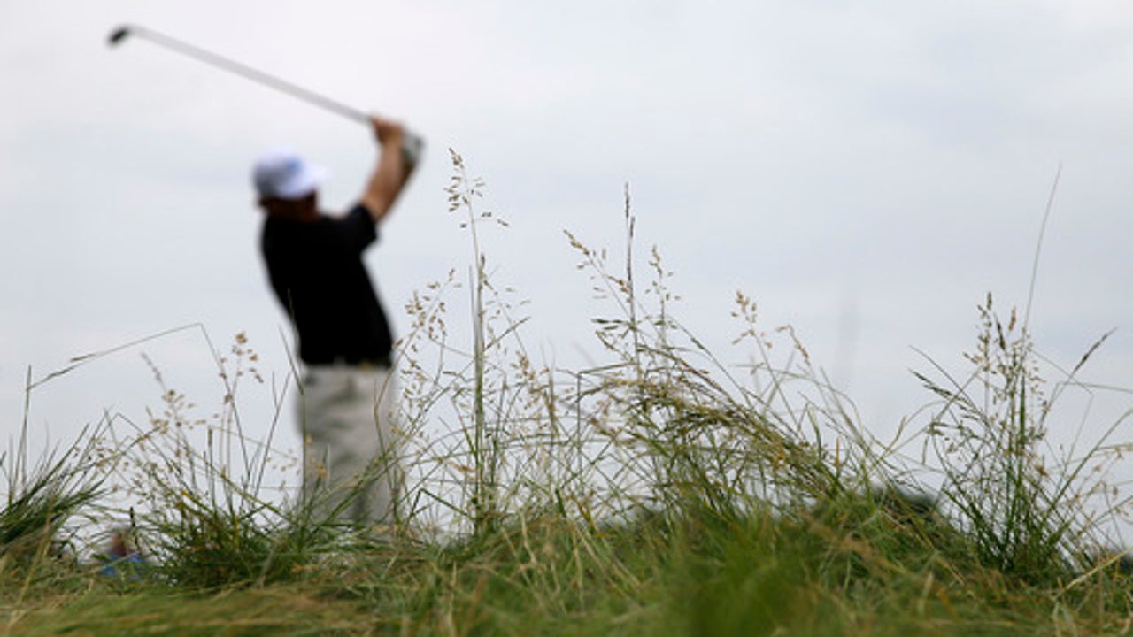 The Latest: Weather suspends play for the day at US Open